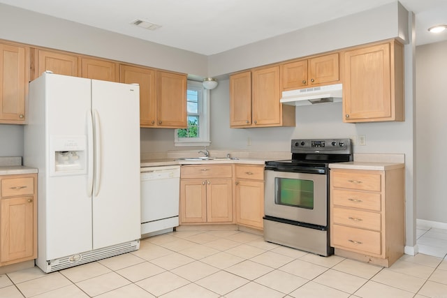 1607 W Washington Ave, Jonesboro, AR 72401 - kitchen with white appliances, under cabinet range hood, light countertops, and light brown cabinets
