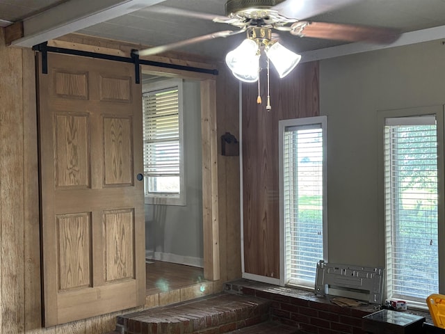 1702 S Ruddle Rd, Blytheville, AR 72315 - entryway with ceiling fan and a barn door
