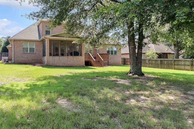 5201 Providence Cir, Jonesboro, AR 72404 - rear view of property featuring brick siding, a sunroom, stairway, and a shingled roof