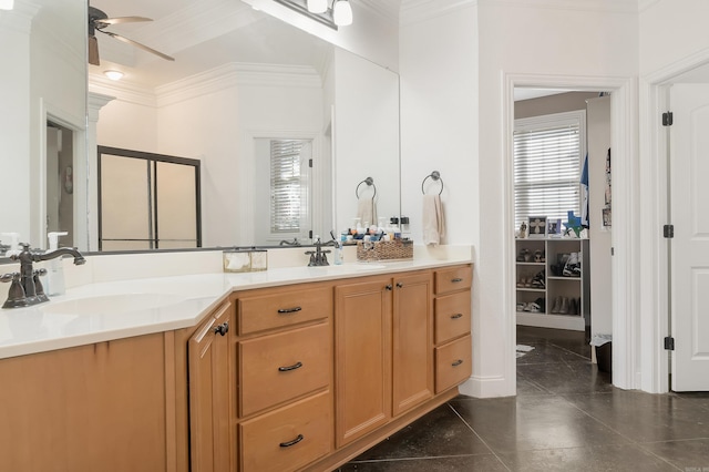 5201 Providence Cir, Jonesboro, AR 72404 - bathroom featuring crown molding, double vanity, ceiling fan, a shower with shower door, and tile patterned flooring