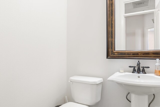 5201 Providence Cir, Jonesboro, AR 72404 - bathroom featuring toilet and a sink