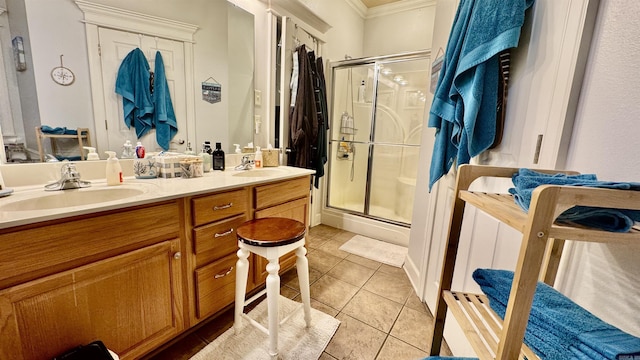 1695 Gardenia, Conway, AR 72034 - full bathroom featuring crown molding, a stall shower, double vanity, and tile patterned floors