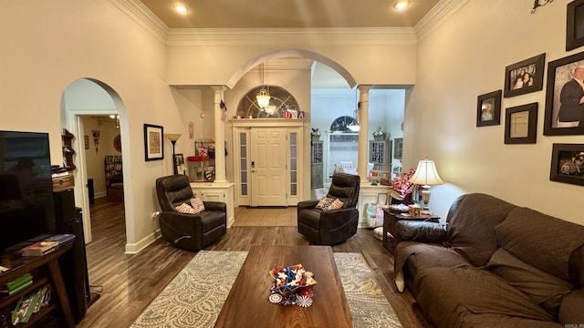 1695 Gardenia, Conway, AR 72034 - living area featuring arched walkways, ornamental molding, wood finished floors, and ornate columns