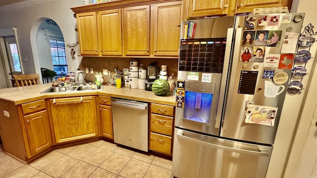 1695 Gardenia, Conway, AR 72034 - kitchen featuring stainless steel appliances, tile counters, light tile patterned flooring, a peninsula, and tasteful backsplash
