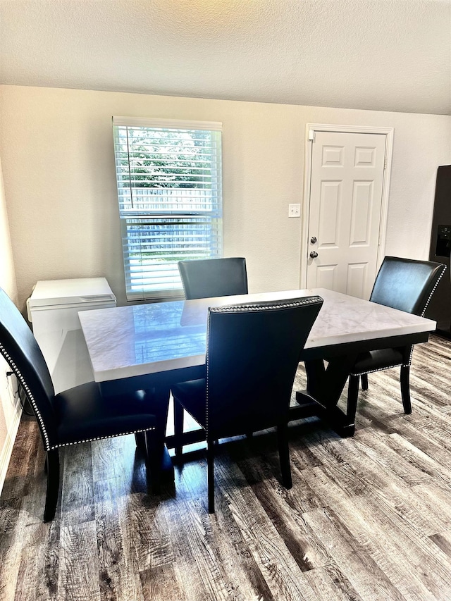 dining area featuring wood finished floors