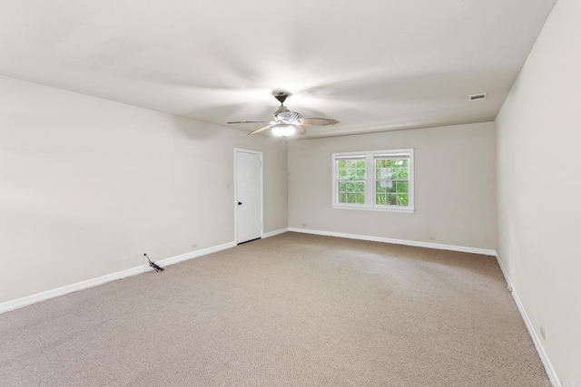 901 S Reine St, Mena, AR 71953 - empty room featuring ceiling fan and light colored carpet