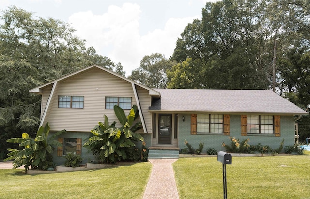 1700 Chitwood St, Benton, AR 72019 - split level home with brick siding, a front yard, and roof with shingles