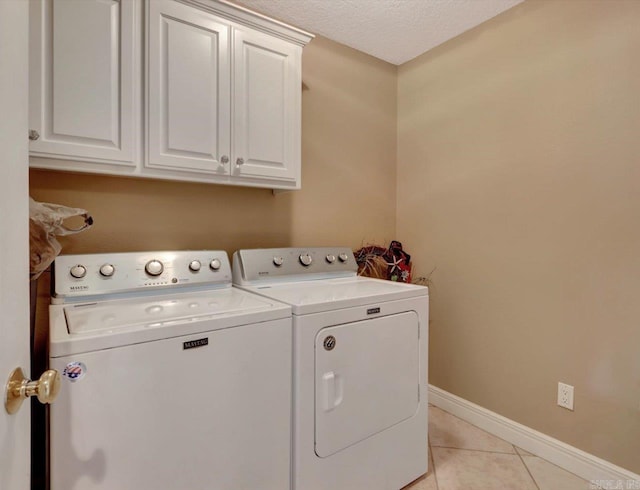 182 Villa Pointe Unit B, Hot Springs, AR 71913 - washroom featuring cabinet space, independent washer and dryer, and light tile patterned flooring
