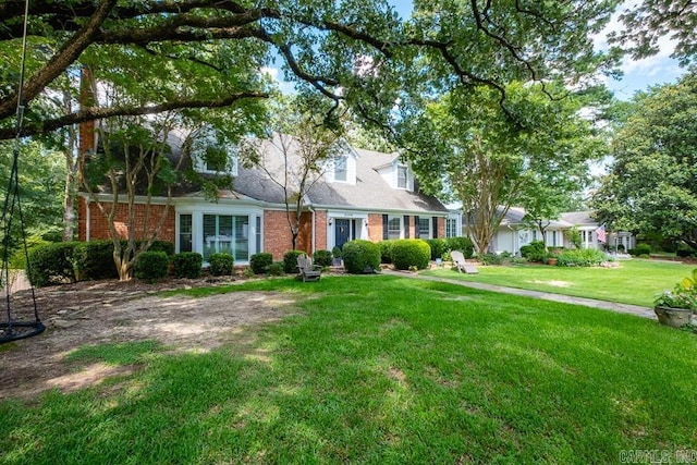 5336 N Grandview, Little Rock, AR 72207 - cape cod house featuring brick siding and a front yard