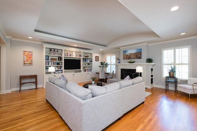 5336 N Grandview, Little Rock, AR 72207 - living area with a raised ceiling, crown molding, recessed lighting, light wood-style floors, and a fireplace