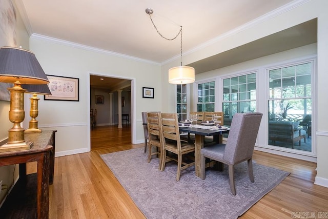 5336 N Grandview, Little Rock, AR 72207 - dining room featuring light wood-style floors and crown molding