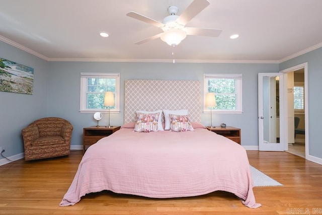5336 N Grandview, Little Rock, AR 72207 - bedroom with multiple windows, wood finished floors, crown molding, ceiling fan, and recessed lighting