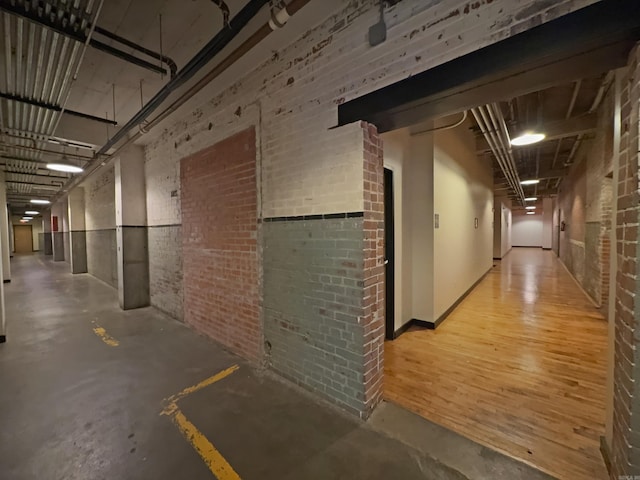 423 E 3rd St Unit 216, Little Rock, AR 72201 - hall featuring brick wall and concrete flooring