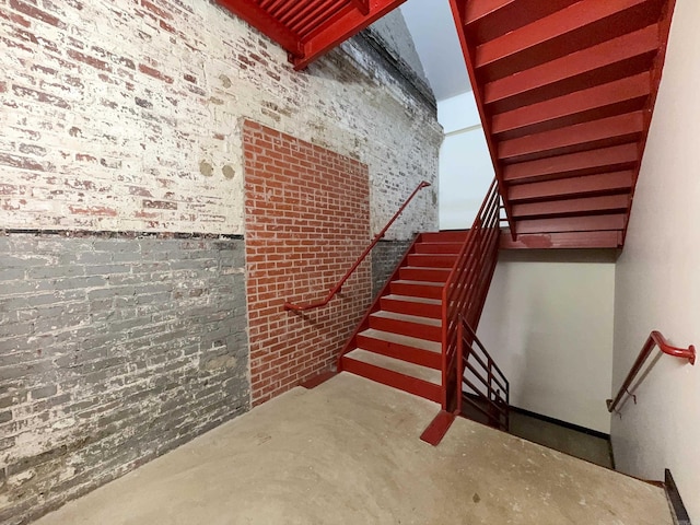 423 E 3rd St Unit 216, Little Rock, AR 72201 - stairs featuring concrete floors and brick wall