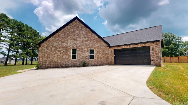 270 Arrowhead Rd, Greenbrier, AR 72058 - view of property exterior with brick siding, driveway, a garage, and a shingled roof