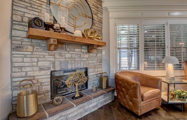 7517 Garden Way, Sherwood, AR 72120 - living area with wood finished floors, a fireplace, and ornamental molding