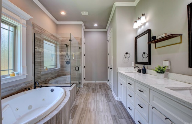 7517 Garden Way, Sherwood, AR 72120 - bathroom featuring healthy amount of natural light, a stall shower, double vanity, a tub with jets, and crown molding