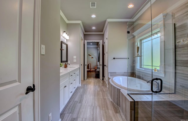7517 Garden Way, Sherwood, AR 72120 - full bathroom with double vanity, a bath, crown molding, recessed lighting, and a stall shower