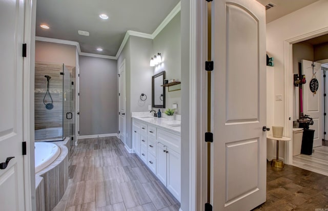 7517 Garden Way, Sherwood, AR 72120 - full bathroom featuring double vanity, a stall shower, a garden tub, ornamental molding, and recessed lighting