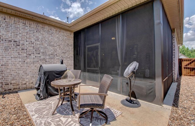 7517 Garden Way, Sherwood, AR 72120 - view of patio / terrace with a sunroom and grilling area