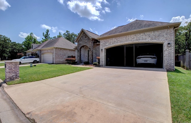 7517 Garden Way, Sherwood, AR 72120 - french country inspired facade featuring brick siding, driveway, a garage, and a front lawn