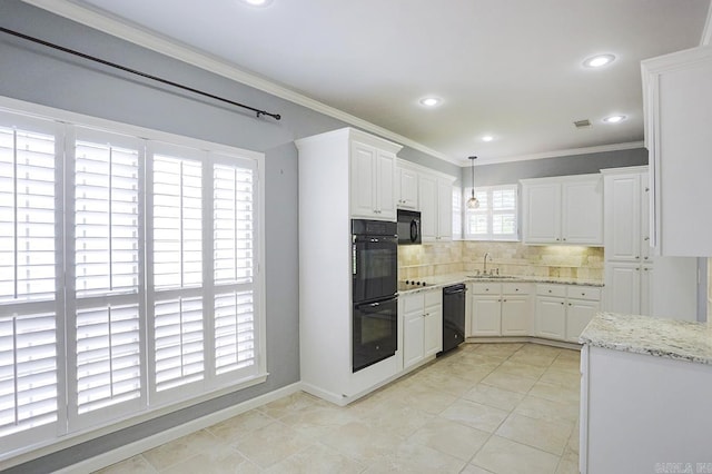1224 N Pt, North Little Rock, AR 72118 - kitchen with black appliances, crown molding, backsplash, white cabinetry, and light stone countertops
