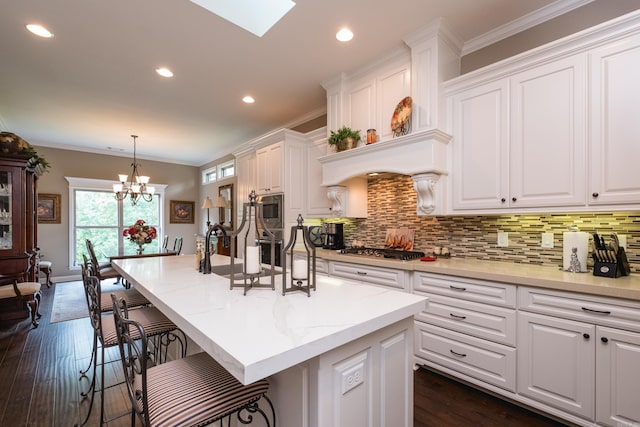 8 Flint Creek Ct, Little Rock, AR 72223 - kitchen with stainless steel appliances, white cabinets, decorative backsplash, crown molding, and recessed lighting