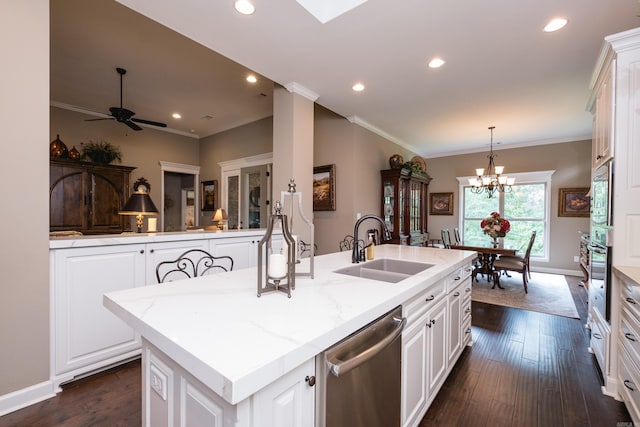8 Flint Creek Ct, Little Rock, AR 72223 - kitchen with appliances with stainless steel finishes, a kitchen island with sink, dark wood finished floors, a chandelier, and crown molding