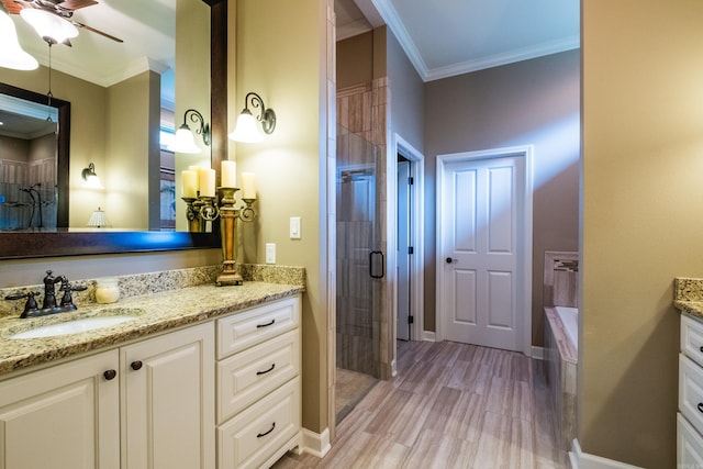 8 Flint Creek Ct, Little Rock, AR 72223 - bathroom featuring vanity, crown molding, a stall shower, a bath, and wood finished floors