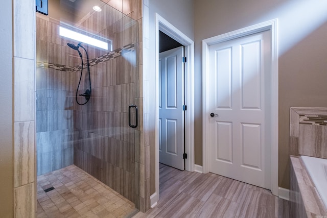 8 Flint Creek Ct, Little Rock, AR 72223 - bathroom featuring a stall shower and a bath