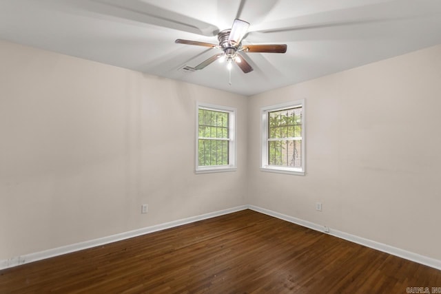 6815 W 34th St, Little Rock, AR 72204 - spare room featuring dark wood-type flooring and a ceiling fan