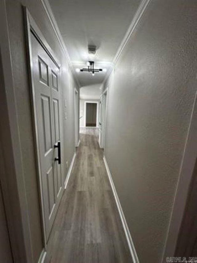 9701 Woodland Dr, Mabelvale, AR 72103 - hall with wood finished floors and crown molding