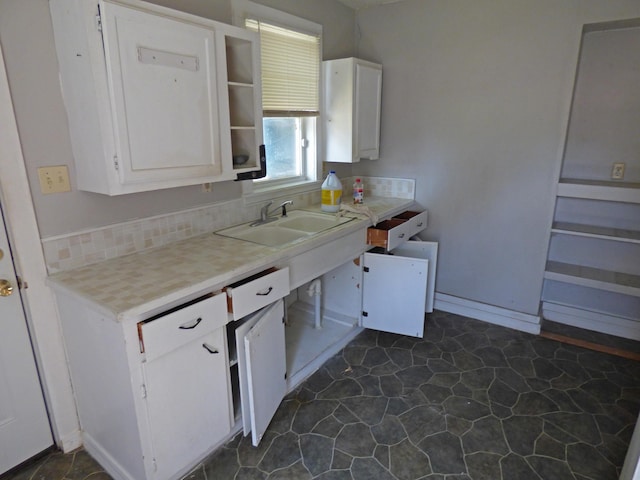 102 E Second St, Hardy, AR 72542 - kitchen featuring white cabinets and light countertops