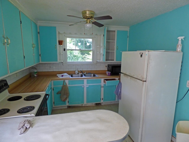 104 W First St, Hardy, AR 72542 - kitchen with freestanding refrigerator, range with electric stovetop, decorative backsplash, ceiling fan, and a textured ceiling