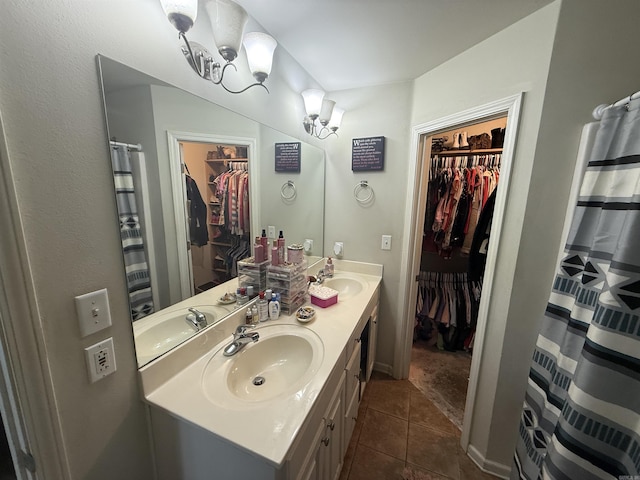 150 Lloyd Henderson Rd, Beebe, AR 72012 - full bath featuring a spacious closet, double vanity, tile patterned floors, and a chandelier