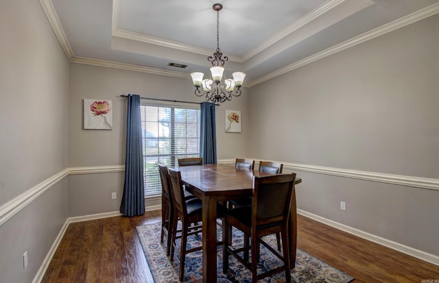 4600 Lexington Park Cir, Bryant, AR 72022 - dining room featuring wood finished floors, a chandelier, a raised ceiling, and crown molding