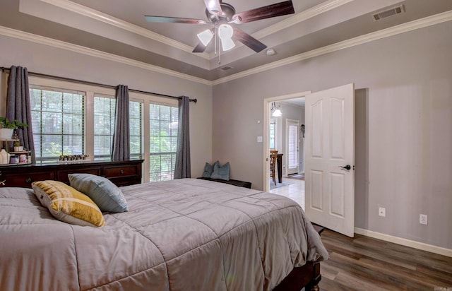 4600 Lexington Park Cir, Bryant, AR 72022 - bedroom featuring wood finished floors, a tray ceiling, ornamental molding, and ceiling fan