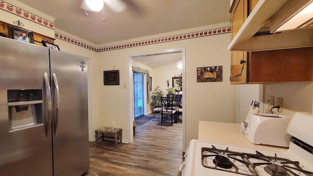 81 Pheasant Run Dr, Cabot, AR 72023 - kitchen featuring stainless steel fridge, white range with gas stovetop, under cabinet range hood, dark wood-style flooring, and a ceiling fan