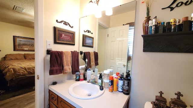81 Pheasant Run Dr, Cabot, AR 72023 - ensuite bathroom with vanity and wood finished floors