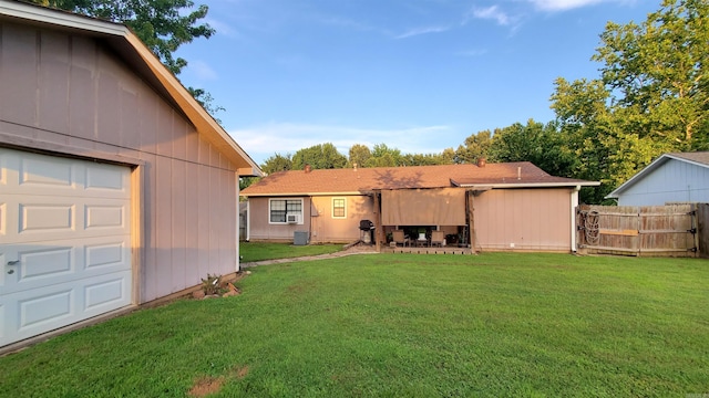 81 Pheasant Run Dr, Cabot, AR 72023 - view of yard with a garage and a patio