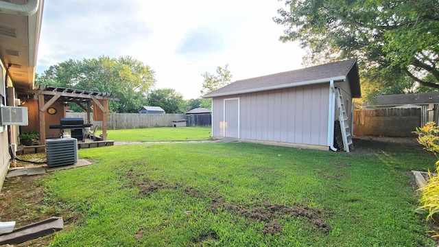 81 Pheasant Run Dr, Cabot, AR 72023 - fenced backyard featuring an outbuilding, cooling unit, and a pergola
