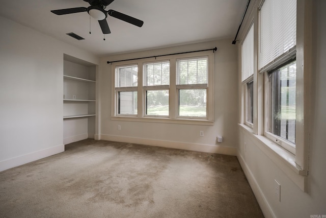 205 S Martin St, Little Rock, AR 72205 - unfurnished bedroom with multiple windows, carpet floors, and ceiling fan