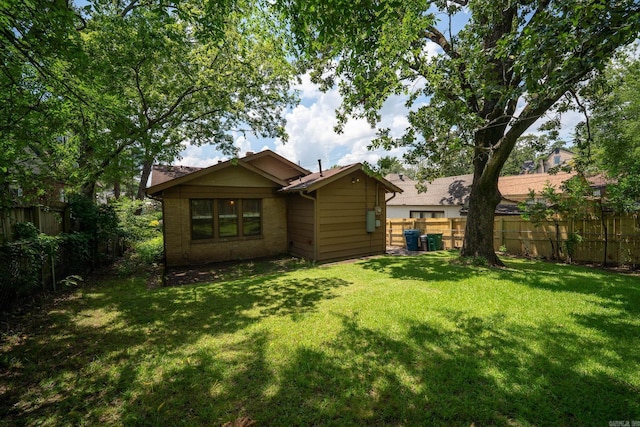 205 S Martin St, Little Rock, AR 72205 - rear view of house with a fenced backyard