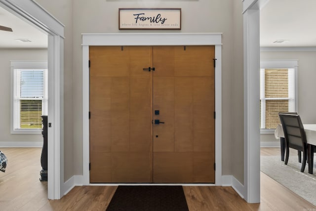 148 Irene Cir, Greenbrier, AR 72058 - foyer entrance with wood finished floors and ornamental molding