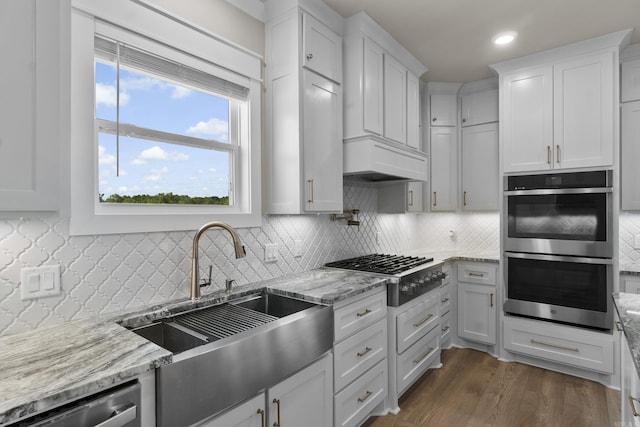 148 Irene Cir, Greenbrier, AR 72058 - kitchen with stainless steel appliances, light stone counters, tasteful backsplash, white cabinetry, and recessed lighting
