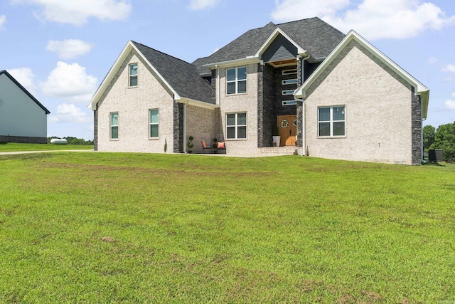 148 Irene Cir, Greenbrier, AR 72058 - rear view of house featuring a yard, brick siding, and roof with shingles