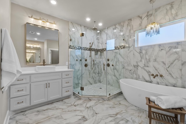 148 Irene Cir, Greenbrier, AR 72058 - full bath with a marble finish shower, marble finish flooring, a chandelier, a freestanding tub, and vanity