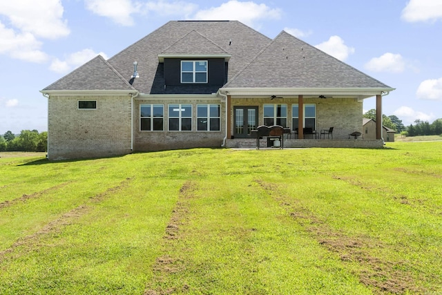 148 Irene Cir, Greenbrier, AR 72058 - back of property featuring a lawn, ceiling fan, a patio area, and a shingled roof