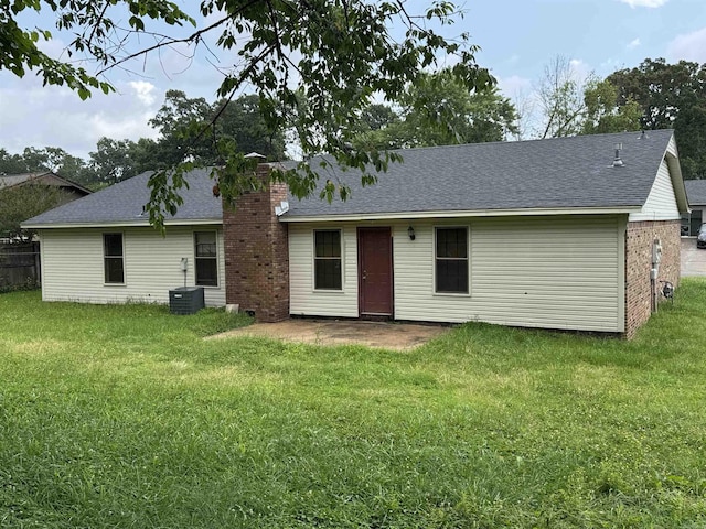 9313 Timber Valley Rd, Little Rock, AR 72204 - rear view of house with a yard, a chimney, a shingled roof, and a patio