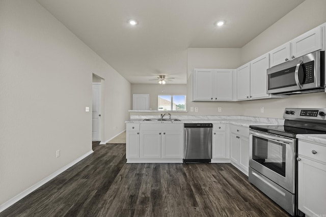 116 Baldwin Dr, Beebe, AR 72012 - kitchen featuring stainless steel appliances, a peninsula, white cabinetry, and recessed lighting